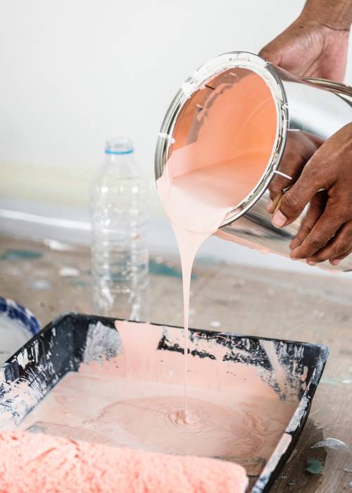 Paint is poured into a tray